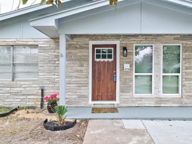 3215 Soway St, Houston, TX 77080 - doorway to property featuring stone siding