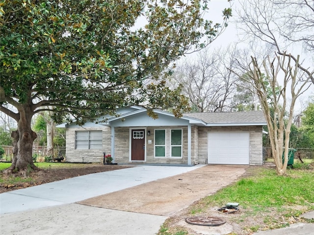 3215 Soway St, Houston, TX 77080 - ranch-style home with driveway, an attached garage, stone siding, and a porch