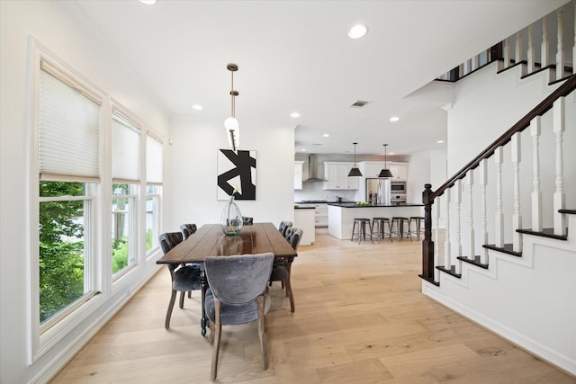 1101 Tabor St, Houston, TX 77009 - dining space with plenty of natural light, stairs, recessed lighting, and light wood-style flooring