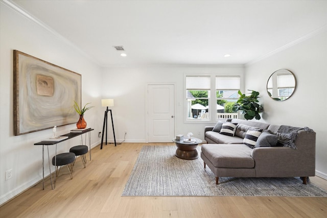 1101 Tabor St, Houston, TX 77009 - living area with ornamental molding, light wood-style floors, and recessed lighting