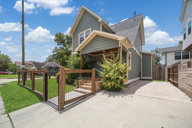 1101 Tabor St, Houston, TX 77009 - view of front of house with a gate and a shingled roof