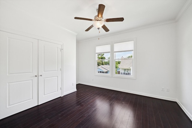 1101 Tabor St, Houston, TX 77009 - unfurnished bedroom with crown molding, a closet, dark wood-style flooring, and ceiling fan