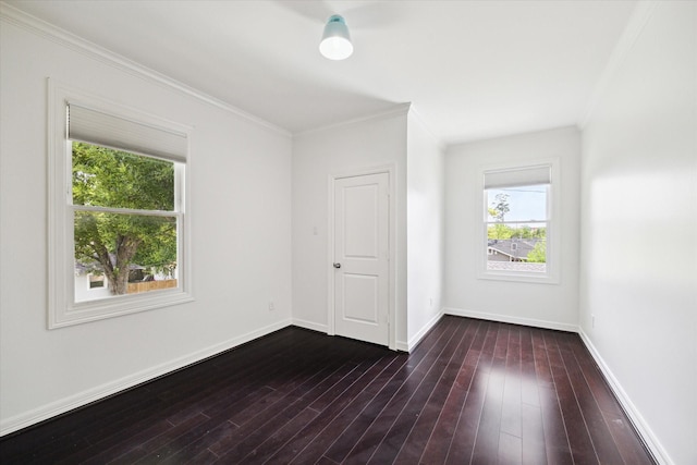 1101 Tabor St, Houston, TX 77009 - unfurnished room featuring plenty of natural light, crown molding, and dark wood-style flooring