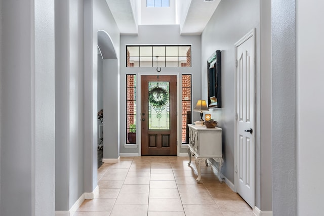 32210 Mink Creek Ct, Magnolia, TX 77355 - foyer featuring arched walkways and light tile patterned floors