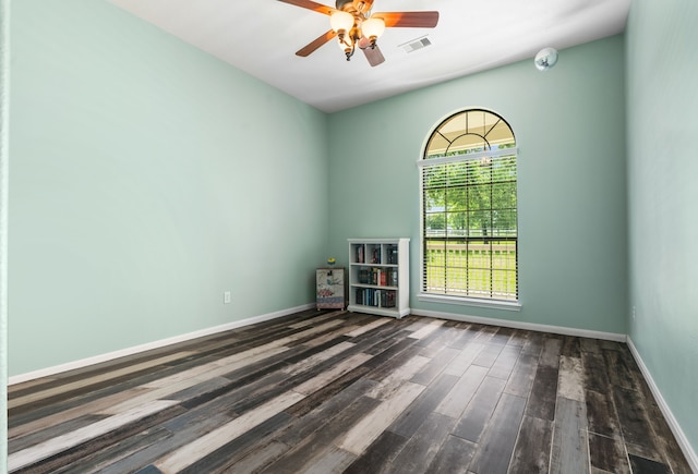 32210 Mink Creek Ct, Magnolia, TX 77355 - empty room featuring dark wood-style flooring, ceiling fan, and a smoke detector