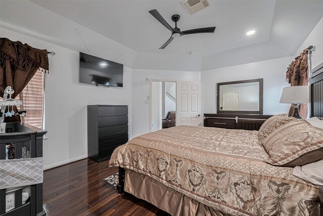 14212 Rocky Briar Ln, Rosharon, TX 77583 - bedroom with dark wood-type flooring, ceiling fan, and a raised ceiling