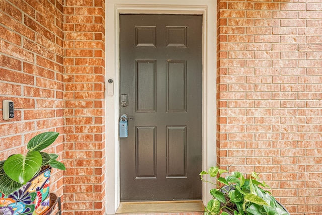 14212 Rocky Briar Ln, Rosharon, TX 77583 - doorway to property featuring brick siding