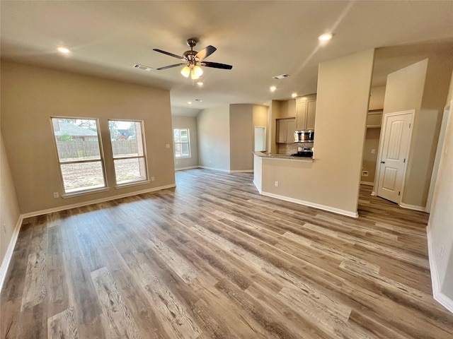 5 Seminole Ct, West Columbia, TX 77486 - unfurnished living room with recessed lighting, light wood-style flooring, and ceiling fan