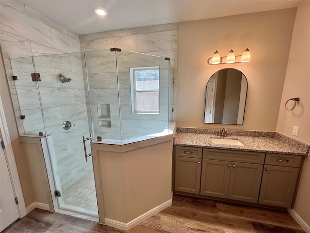 5 Seminole Ct, West Columbia, TX 77486 - full bath featuring vanity, wood finished floors, and a stall shower