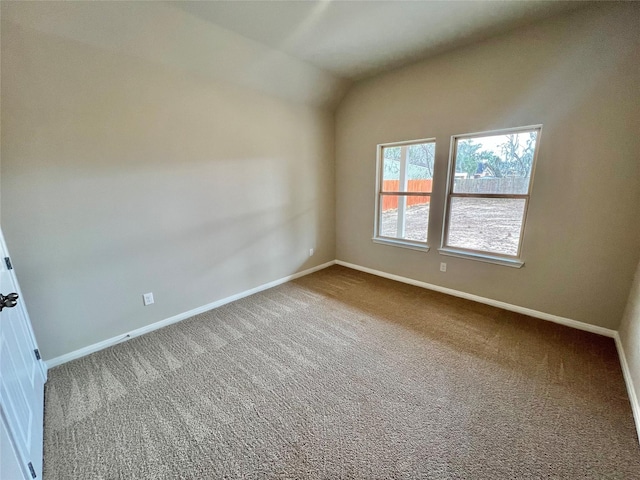 5 Seminole Ct, West Columbia, TX 77486 - carpeted spare room featuring baseboards and vaulted ceiling