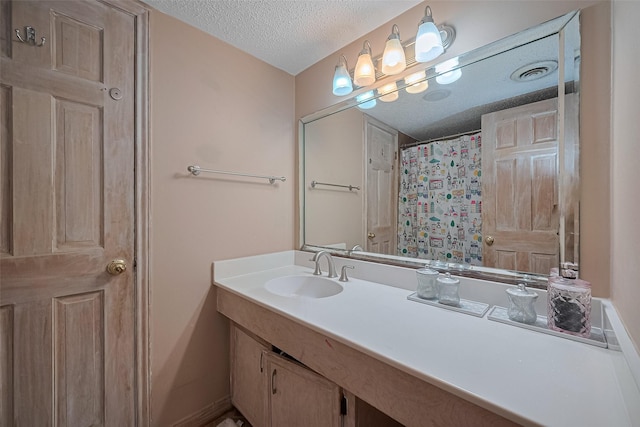 674 S Ripple Creek Dr Unit 674, Houston, TX 77057 - full bathroom with a textured ceiling and vanity