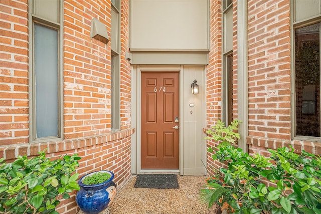 674 S Ripple Creek Dr Unit 674, Houston, TX 77057 - doorway to property with brick siding