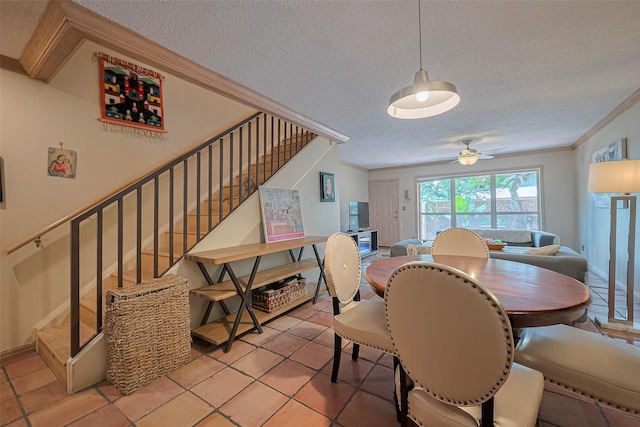 674 S Ripple Creek Dr Unit 674, Houston, TX 77057 - dining area with stairway, a textured ceiling, crown molding, a ceiling fan, and light tile patterned floors
