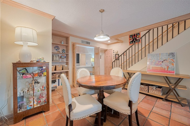 674 S Ripple Creek Dr Unit 674, Houston, TX 77057 - tiled dining room with stairs, a textured ceiling, built in features, and ornamental molding