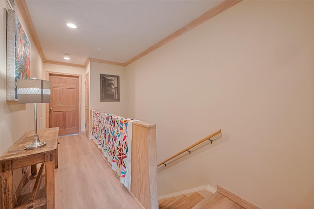 674 S Ripple Creek Dr Unit 674, Houston, TX 77057 - corridor featuring an upstairs landing, ornamental molding, light wood-type flooring, and recessed lighting