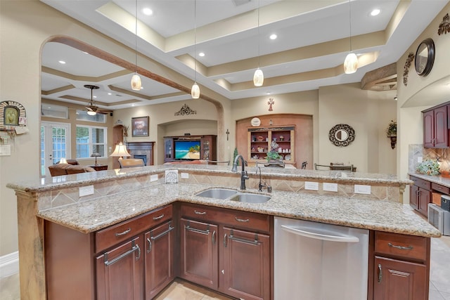 5702 Silverthorn Glen Dr, Spring, TX 77379 - kitchen with dishwasher, open floor plan, ceiling fan, coffered ceiling, and pendant lighting