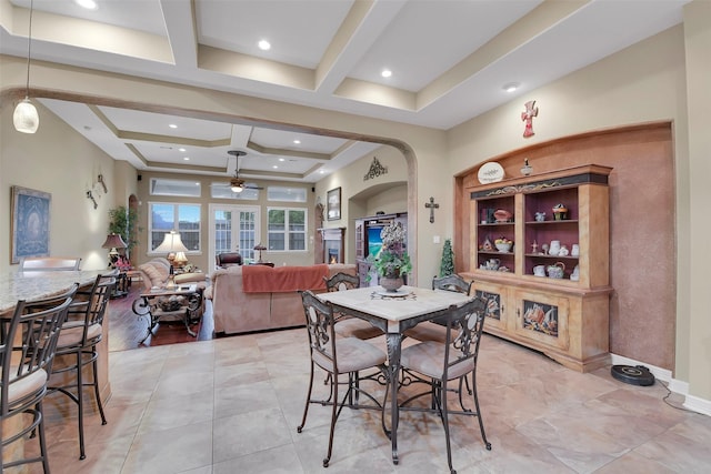 5702 Silverthorn Glen Dr, Spring, TX 77379 - dining space featuring arched walkways, a ceiling fan, coffered ceiling, beamed ceiling, and recessed lighting