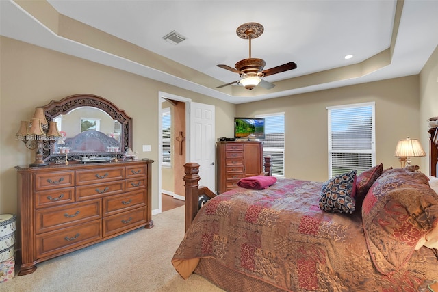 5702 Silverthorn Glen Dr, Spring, TX 77379 - bedroom featuring a raised ceiling, light colored carpet, ceiling fan, and recessed lighting