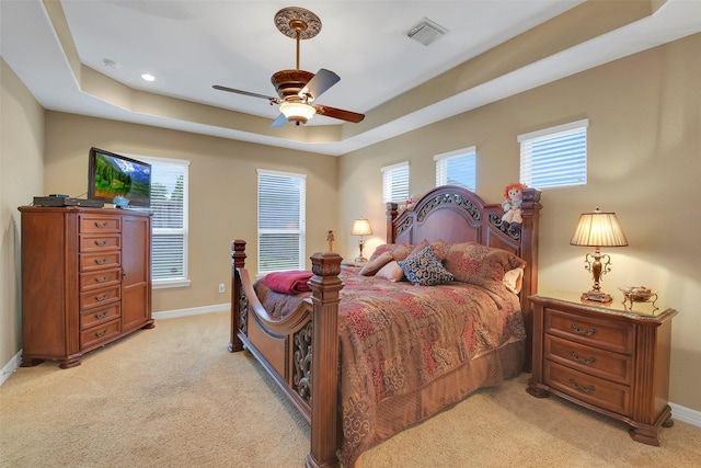 5702 Silverthorn Glen Dr, Spring, TX 77379 - bedroom featuring light colored carpet, a tray ceiling, a ceiling fan, and recessed lighting