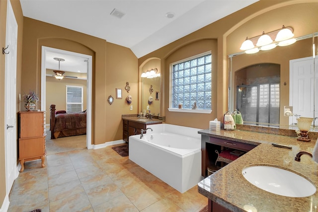 5702 Silverthorn Glen Dr, Spring, TX 77379 - ensuite bathroom with two vanities, a stall shower, a bath, and lofted ceiling