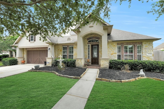 5702 Silverthorn Glen Dr, Spring, TX 77379 - view of front of home featuring stone siding, a front lawn, driveway, and a garage
