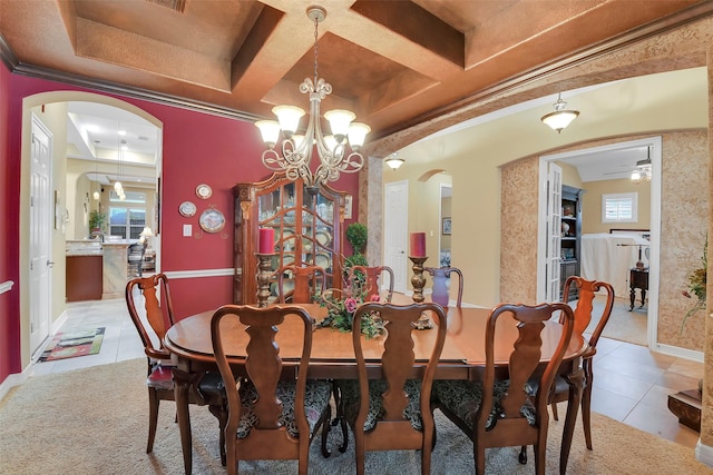 5702 Silverthorn Glen Dr, Spring, TX 77379 - tiled dining room with arched walkways, a chandelier, coffered ceiling, and ceiling fan