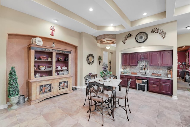 5702 Silverthorn Glen Dr, Spring, TX 77379 - dining space featuring bar area, arched walkways, and recessed lighting