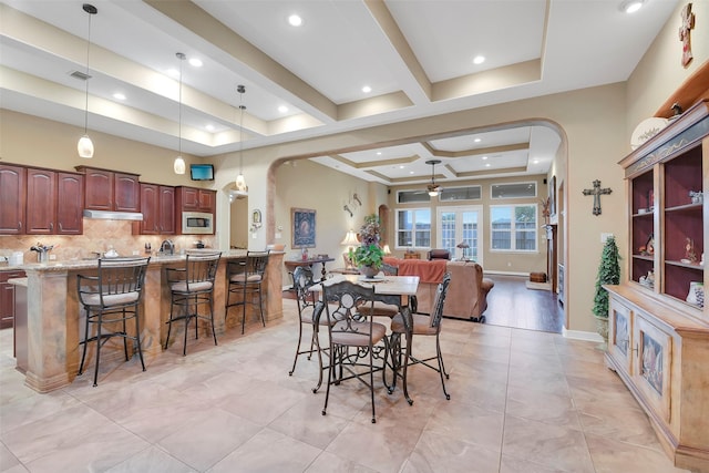 5702 Silverthorn Glen Dr, Spring, TX 77379 - dining room featuring arched walkways, a ceiling fan, coffered ceiling, light tile patterned floors, and recessed lighting