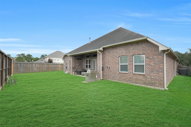 5702 Silverthorn Glen Dr, Spring, TX 77379 - rear view of house featuring a fenced backyard and brick siding