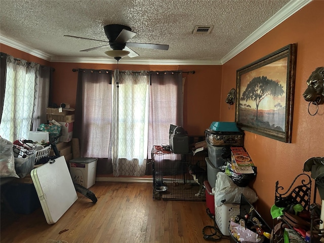1506 Cordell St, Houston, TX 77009 - misc room with a textured ceiling, wood finished floors, ceiling fan, and crown molding
