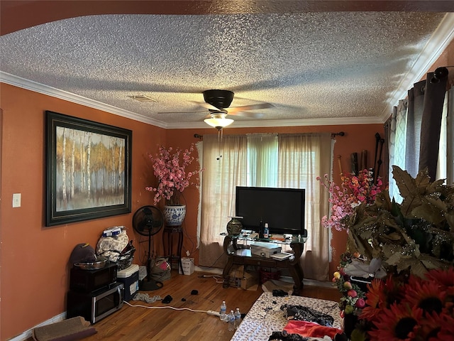 1506 Cordell St, Houston, TX 77009 - living area with wood finished floors, a textured ceiling, crown molding, and ceiling fan