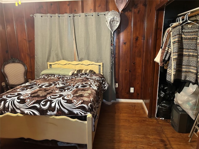1506 Cordell St, Houston, TX 77009 - bedroom with dark wood finished floors and wooden walls
