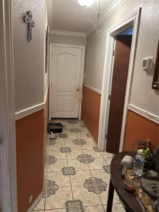 1506 Cordell St, Houston, TX 77009 - hall featuring light tile patterned floors, crown molding, and a textured ceiling