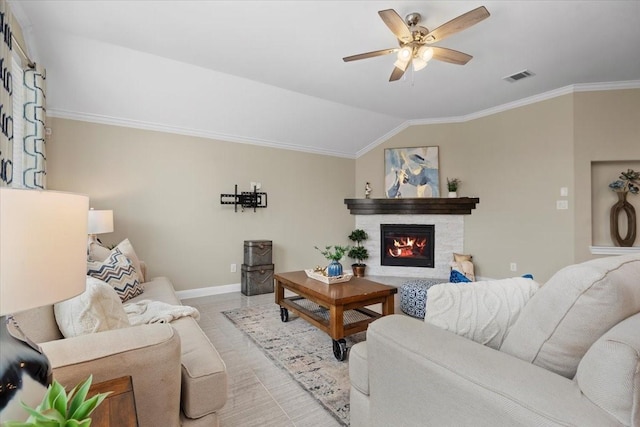 18135 Berry Garden Ln, Spring, TX 77379 - living area with crown molding, ceiling fan, a glass covered fireplace, and vaulted ceiling
