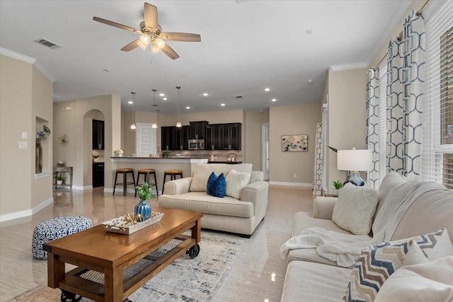 18135 Berry Garden Ln, Spring, TX 77379 - living area with crown molding, ceiling fan, recessed lighting, arched walkways, and light tile patterned floors