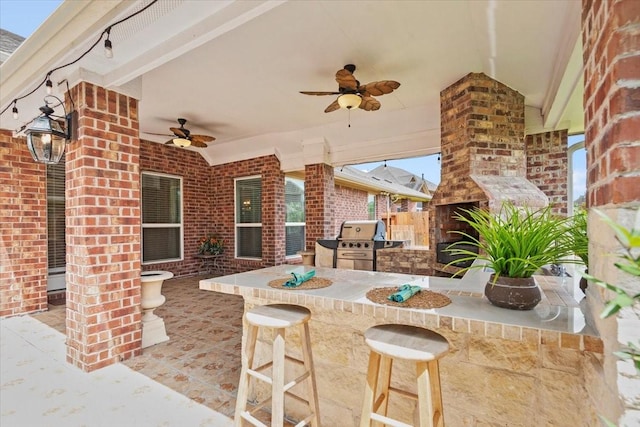 18135 Berry Garden Ln, Spring, TX 77379 - view of patio with a ceiling fan and exterior kitchen