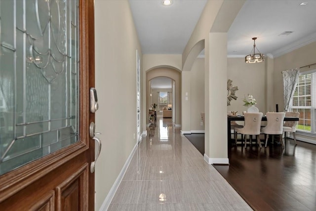 18135 Berry Garden Ln, Spring, TX 77379 - entrance foyer with arched walkways, a chandelier, and crown molding