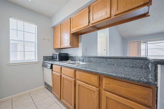 3100 Jeanetta St Unit 1104, Houston, TX 77063 - kitchen with dishwasher, stainless steel microwave, a textured ceiling, light tile patterned floors, and dark countertops
