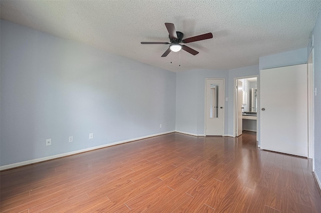 3100 Jeanetta St Unit 1104, Houston, TX 77063 - spare room featuring ceiling fan, wood finished floors, and a textured ceiling