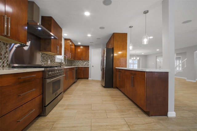 15815 Baytree Dr, Houston, TX 77070 - kitchen featuring stainless steel appliances, wall chimney exhaust hood, backsplash, light countertops, and a peninsula