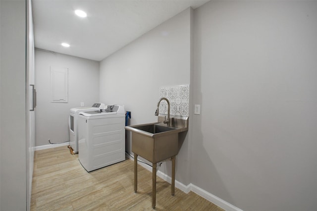 15815 Baytree Dr, Houston, TX 77070 - washroom with separate washer and dryer, light wood-type flooring, and recessed lighting