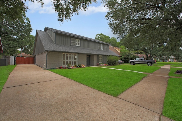 15815 Baytree Dr, Houston, TX 77070 - traditional home with driveway, brick siding, a gate, and roof with shingles
