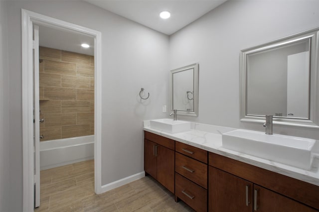 15815 Baytree Dr, Houston, TX 77070 - full bath with double vanity, wood finished floors, bathtub / shower combination, and recessed lighting