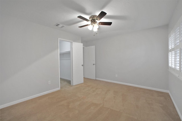 15815 Baytree Dr, Houston, TX 77070 - unfurnished bedroom featuring light carpet, a spacious closet, and a ceiling fan