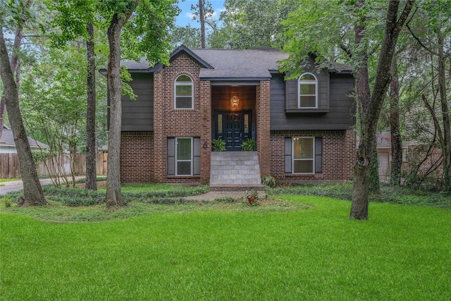 6 Sylvan Forest Dr, The Woodlands, TX 77381 - bi-level home with brick siding and a shingled roof