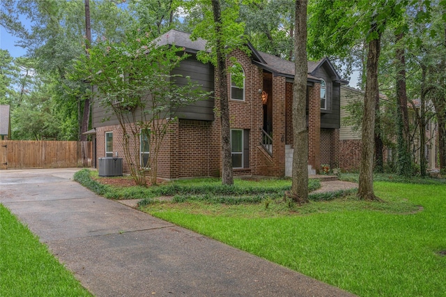 6 Sylvan Forest Dr, The Woodlands, TX 77381 - view of front of property featuring brick siding and driveway