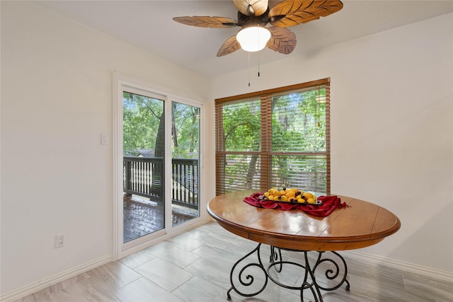 6 Sylvan Forest Dr, The Woodlands, TX 77381 - dining area with baseboards and a ceiling fan