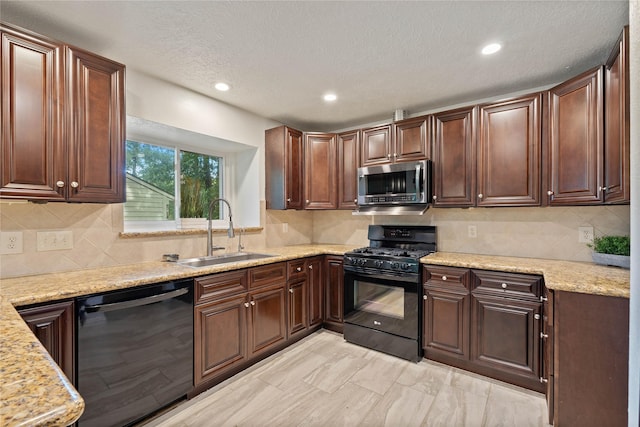 6 Sylvan Forest Dr, The Woodlands, TX 77381 - kitchen with stainless steel microwave, black gas range oven, dishwashing machine, recessed lighting, and decorative backsplash