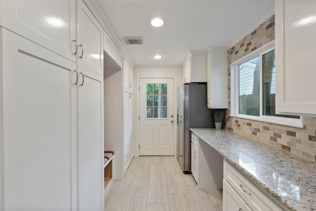6 Sylvan Forest Dr, The Woodlands, TX 77381 - mudroom with healthy amount of natural light, crown molding, and recessed lighting