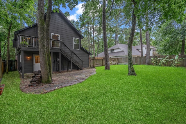 6 Sylvan Forest Dr, The Woodlands, TX 77381 - rear view of property with stairway, a fenced backyard, and a wooden deck